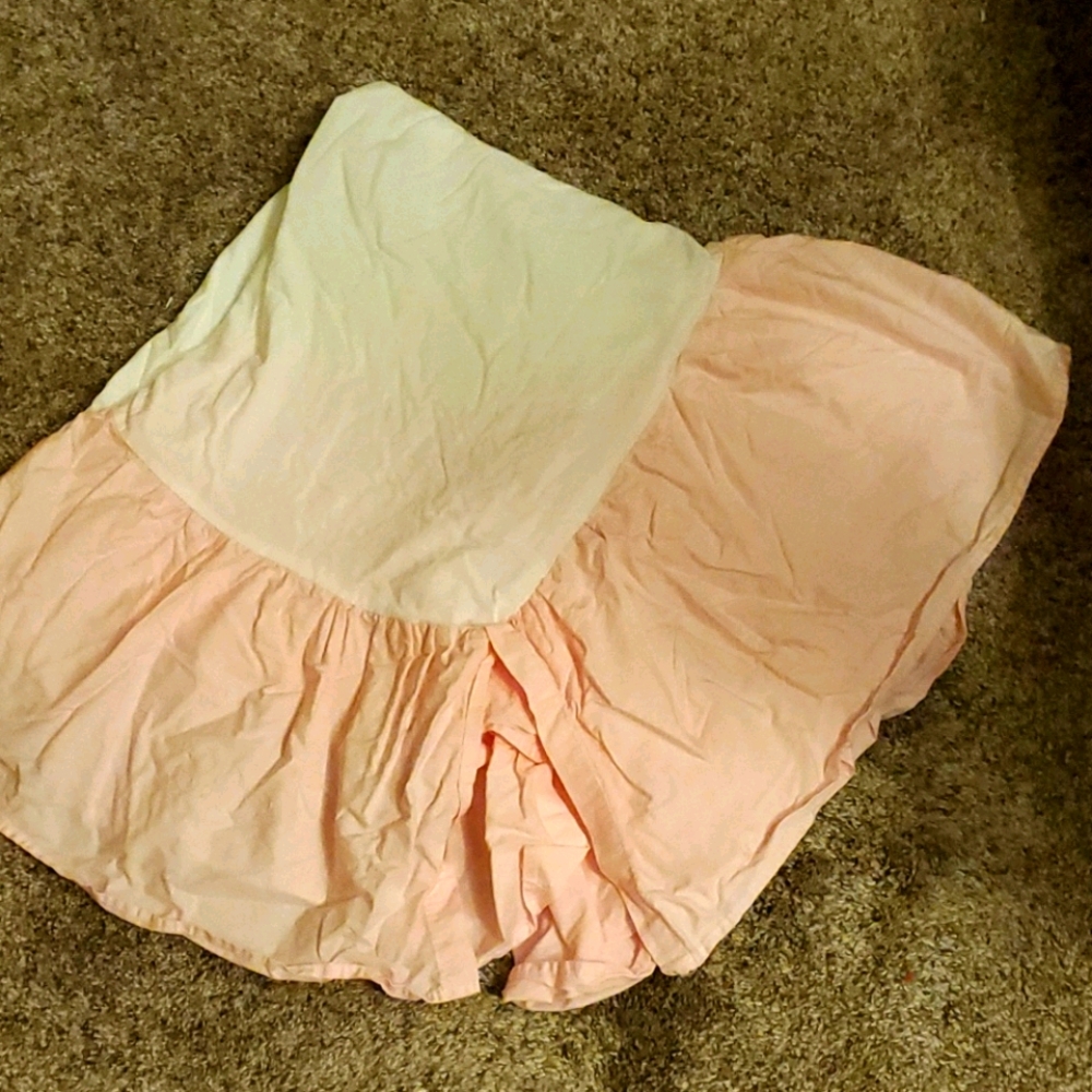 Pink and white crib skirt